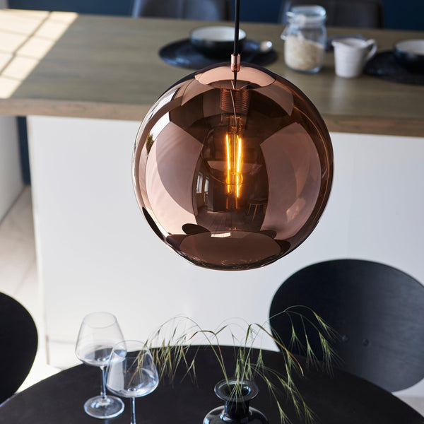 The Endon Boli 1 Light Globe Pendant features copper mirrored glass with matt black metalwork for a modern, contemporary look. This dimmable pendant light is perfect for creating an elegant atmosphere in your living room, dining area, or entryway.