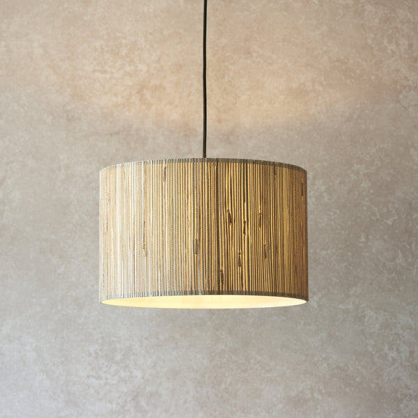 Endon Longshore 1-Light Pendant Drum Light Natural Seagrass – A modern rustic pendant light featuring a woven natural seagrass shade and matt black metal fixtures. Dimmable and height-adjustable, this warm, ambient lighting piece is perfect for coastal, bohemian, and contemporary interiors.