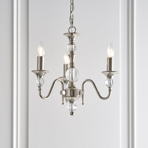 Interiors 1900 Polina 3-Light Chandelier in Polished Nickel – A classic chandelier with a polished nickel frame, clear crystal accents, and elegant detailing. Designed with three lights, adjustable height, and dimmable functionality, it’s ideal for traditional and contemporary interiors. Uses 3 x E14 bulbs (not included).