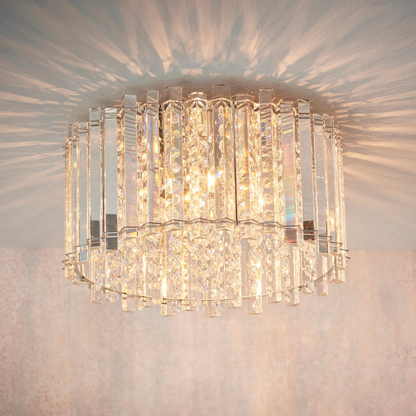 Endon Hanna 4-Light Flush Ceiling Light Chrome – A luxurious crystal ceiling light featuring high-quality K5 reflective clear crystals and polished chrome details. Designed for G9 lamps, this flush mount fixture is ideal for low ceilings, adding opulent lighting to living rooms, dining areas, bedrooms, and hallways. Matches with the coordinating pendant and wall light for a cohesive interior design.
