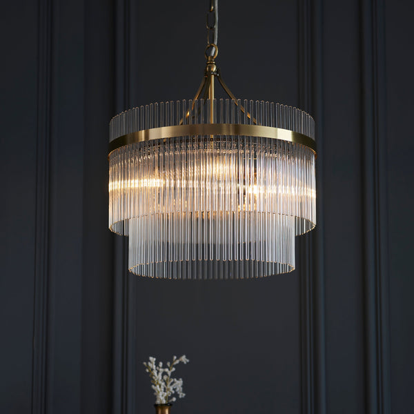 Endon Marietta 3-Light Pendant Drum Light Antique Brass – A contemporary chandelier with an antique brass finish and decorative clear glass rods. Height-adjustable and dimmable, this elegant pendant light is perfect for dining rooms, living spaces, and entryways, offering a warm, sophisticated glow.