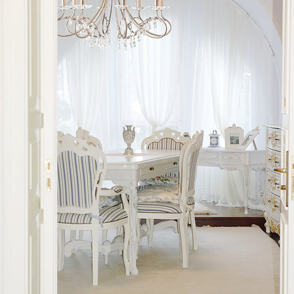 This Elstead Christina classic silver and gold 8 light chandelier with crystal drops and cut glass sconces is handmade in England and features a circular ceiling mount and chain link suspension.