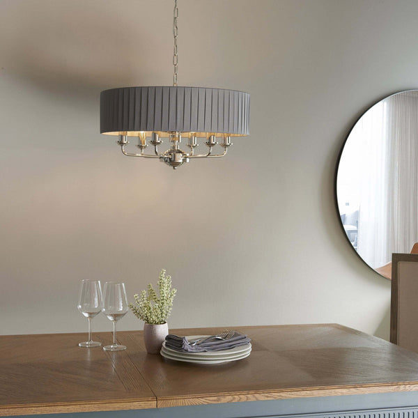 Endon Highclere 6-Light Pendant Drum Light Bright Nickel & Charcoal – A luxurious pendant light featuring a charcoal silk mix fabric shade, bright nickel metalwork, and six elegant arms. Height-adjustable and dimmable, this statement lighting piece is perfect for dining rooms, living rooms, and sophisticated interiors.