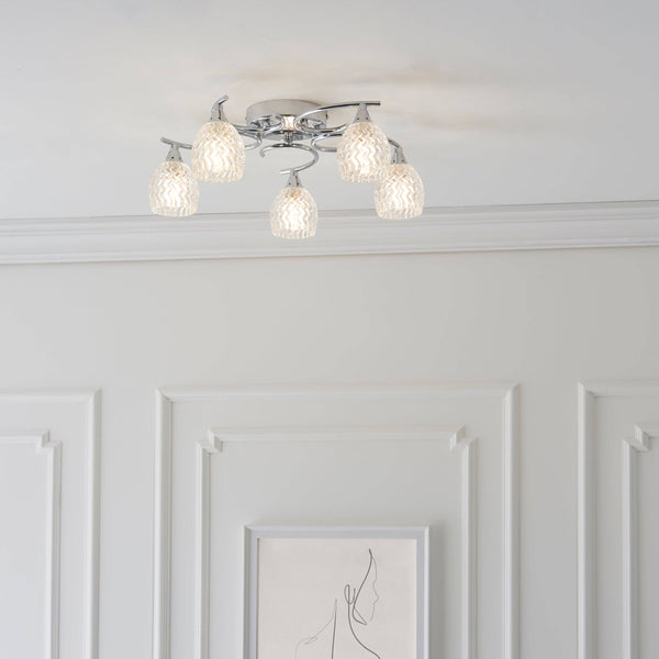 The Endon Boyer 5-Light Rectangular Pendant Light in Chrome features elegantly curved arms, cut glass shades, and a polished chrome finish, offering a sophisticated and modern lighting solution.
