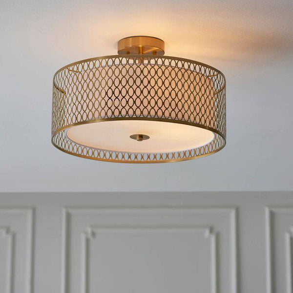 Endon Cordero 3-Light Flush Ceiling Light Gold – A modern and elegant ceiling fixture featuring a luxurious gold finish, high-quality fabric and metal construction, and E27 GLS bulb compatibility. This dimmable flush light is perfect for low ceilings, adding warm and inviting illumination to living rooms, dining areas, bedrooms, and hallways.