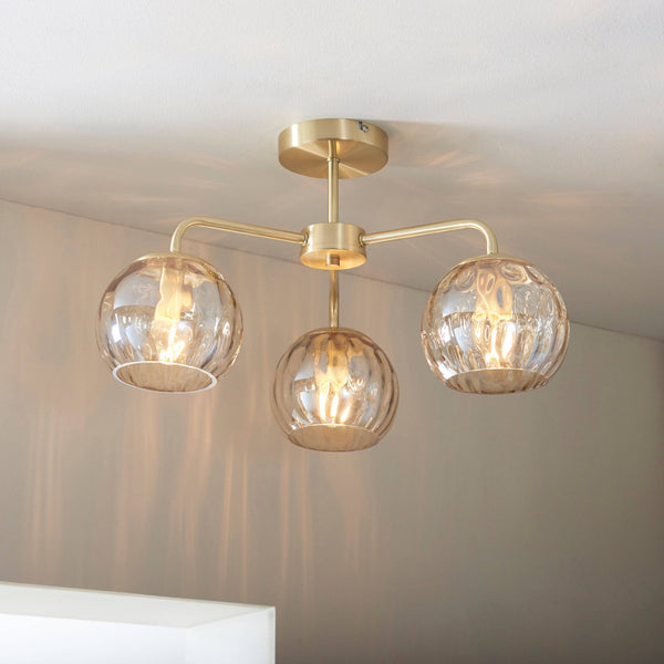 Endon Dimple 3-Light Rectangular Pendant Light in Brass features champagne lustre glass shades, a satin brushed gold finish, and a low-profile design, making it a stylish and practical lighting solution for modern interiors.