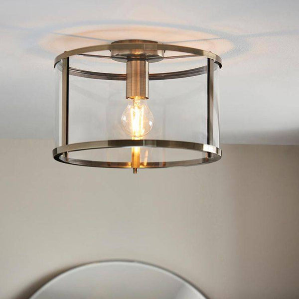 Endon Hopton Flush Ceiling Light Antique Brass – A timeless and elegant ceiling fixture featuring an antique brass finish, durable steel and glass construction, and E27 GLS bulb compatibility. This dimmable flush light is perfect for low ceilings, offering adjustable illumination and classic sophistication to living rooms, hallways, bedrooms, and dining areas.