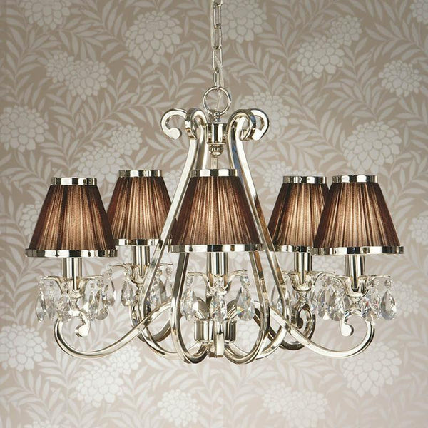 Interiors 1900 Oksana 5-Light Crystal Chandelier in Polished Nickel with Chocolate Shades – A luxurious chandelier featuring a sleek nickel finish, faceted crystal embellishments, and five arms adorned with rich chocolate fabric shades. Adjustable height (59cm-149cm), dimmable compatible, and uses 5 x E14 bulbs (not included).