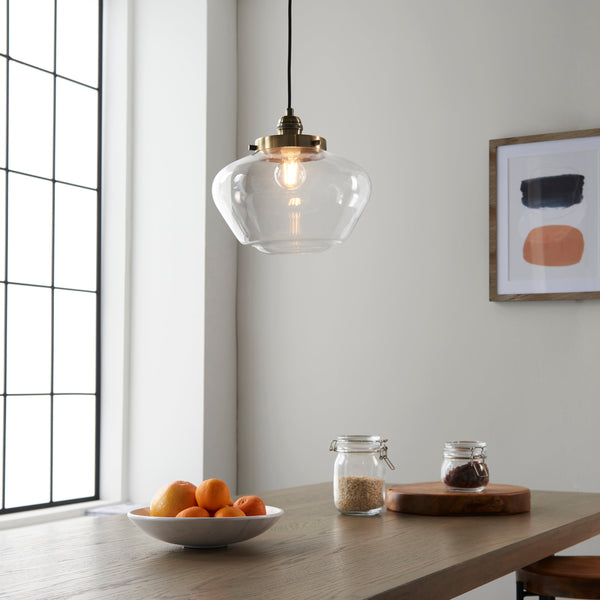Single pendant lights hanging over a kitchen island