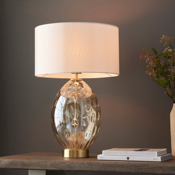 Endon Elin Dimple Touch Table Lamp in champagne glass and satin brass in a styled living room
