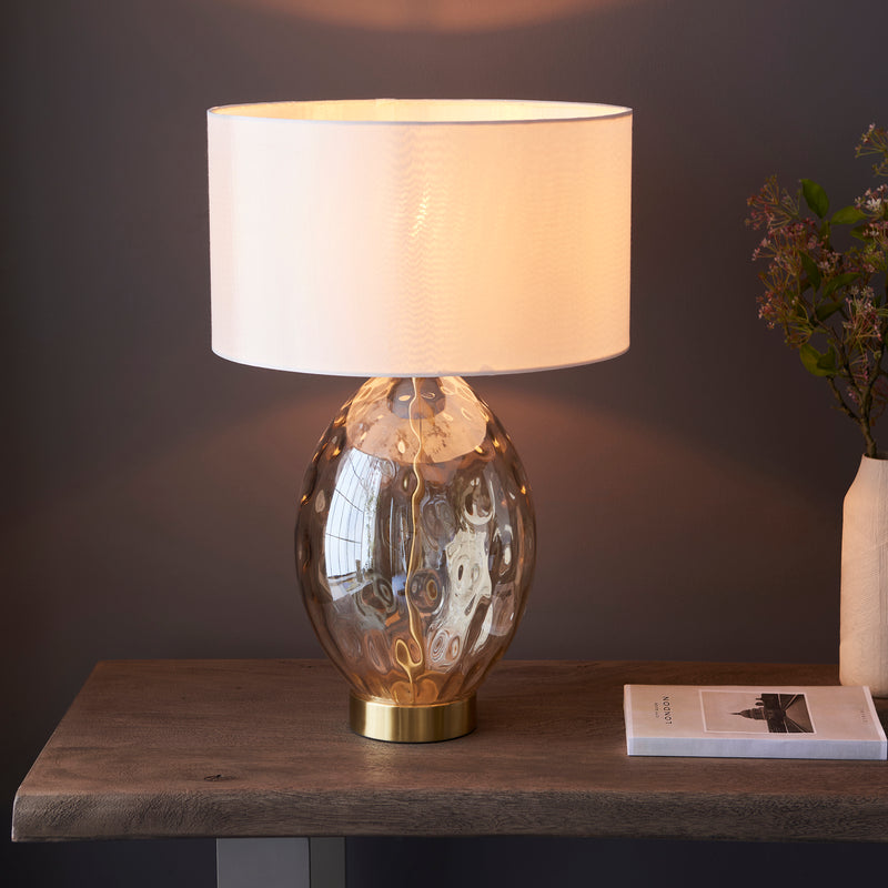 Elin Dimple Touch Table Lamp lit up in a living room setting