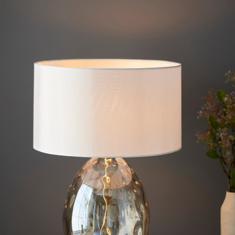 Detail of the champagne glass and satin brass finish on the Elin Dimple Touch Table Lamp
