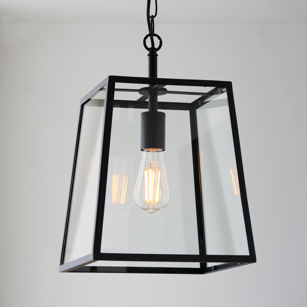 Hurst Lantern Pendant in matt black hanging in a hallway