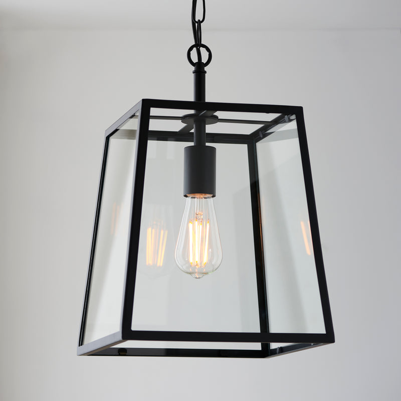 Hurst Lantern Pendant in matt black hanging in a hallway