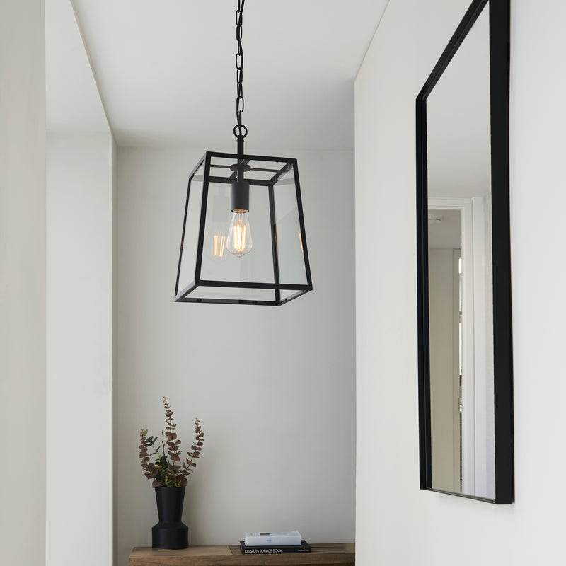 Hurst Lantern Pendant lit up in a styled hallway