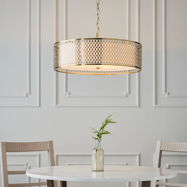 Cordero 3 Light Pendant lit up in a styled living room