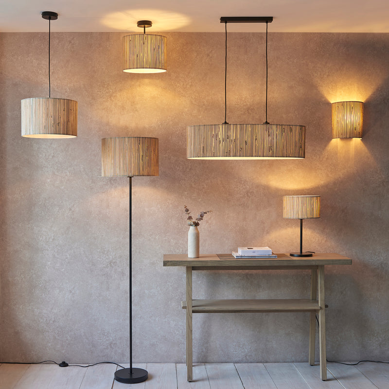 Longshore 2 Light Linear Pendant lit up in a styled dining room