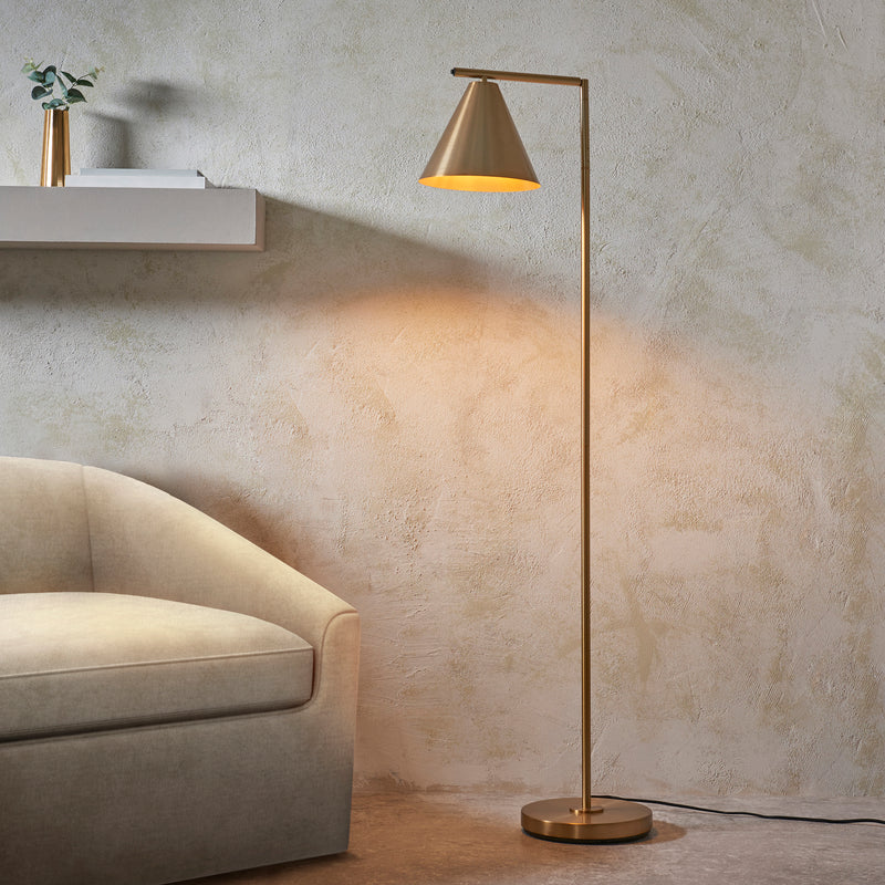 Cape Task Floor Lamp lit up in a living room setting