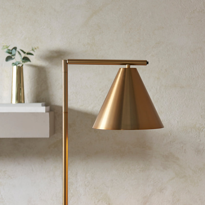 Cape Task Floor Lamp lit up in a living room setting