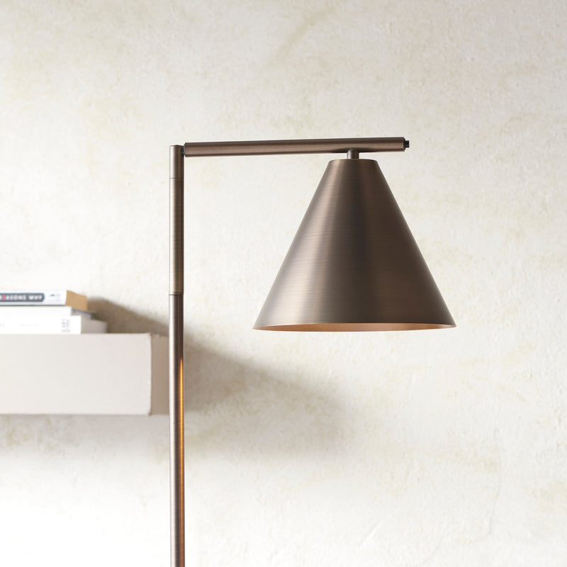 Cape Task Floor Lamp lit up in a living room setting