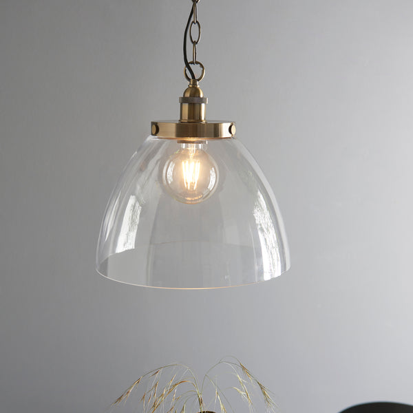 Hansen Grand Pendant in antique brass hanging in a kitchen