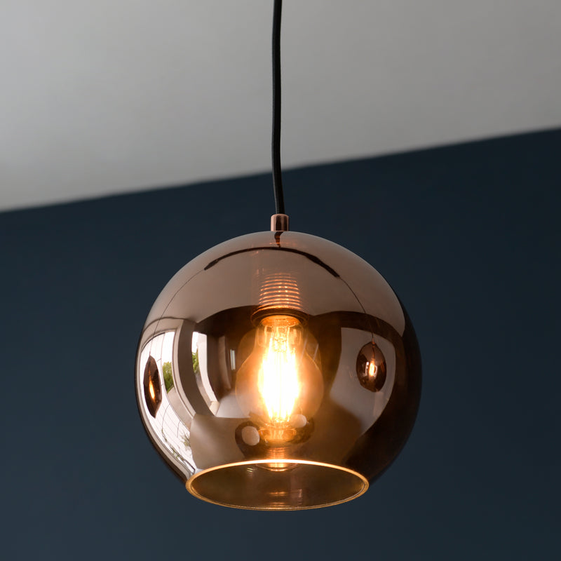 Detail of the matt black and copper glass finish on the Boli 3 Light Linear Pendant