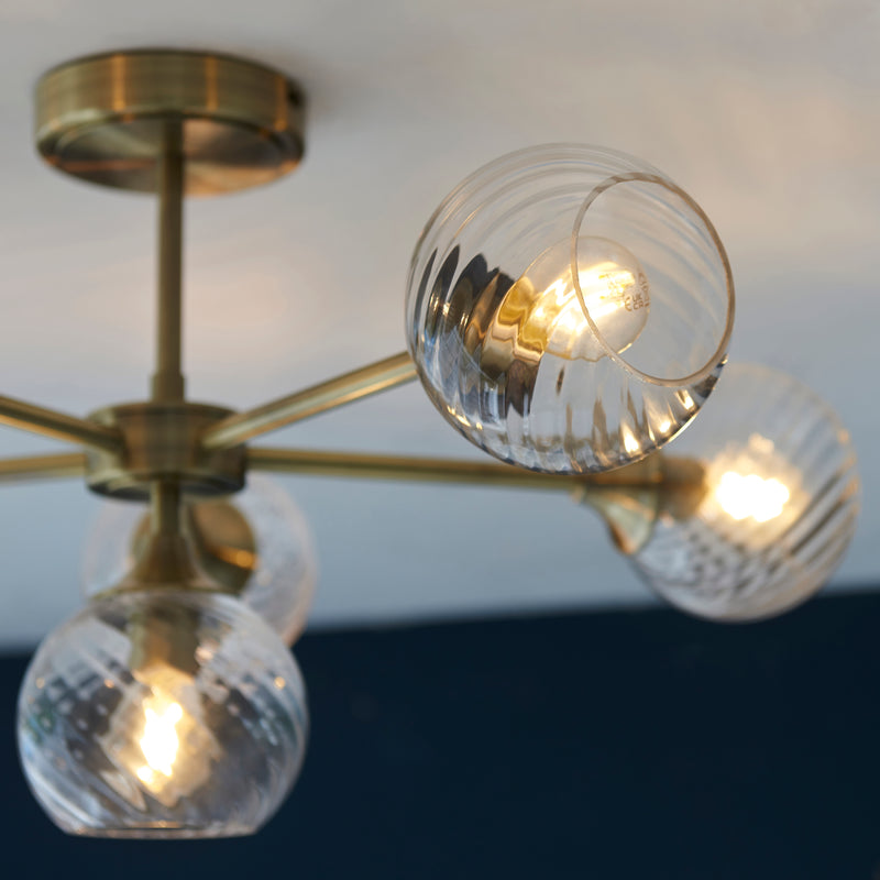 Detail of the antique brass finish on the Allegra 6 Light Semi Flush Ceiling Light