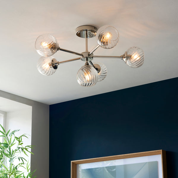 Allegra 6 Light Semi Flush Ceiling Light lit up in a styled living room