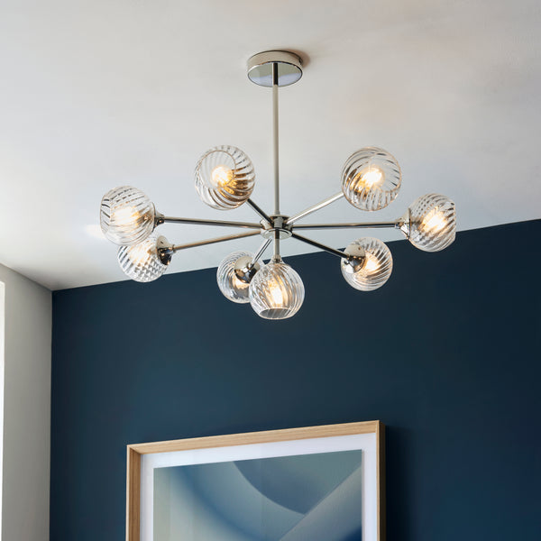 Allegra 8 Light Chandelier in bright nickel on a living room ceiling