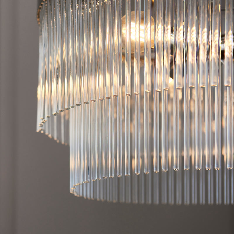 Marietta 5 Light Chandelier lit up in a styled living room