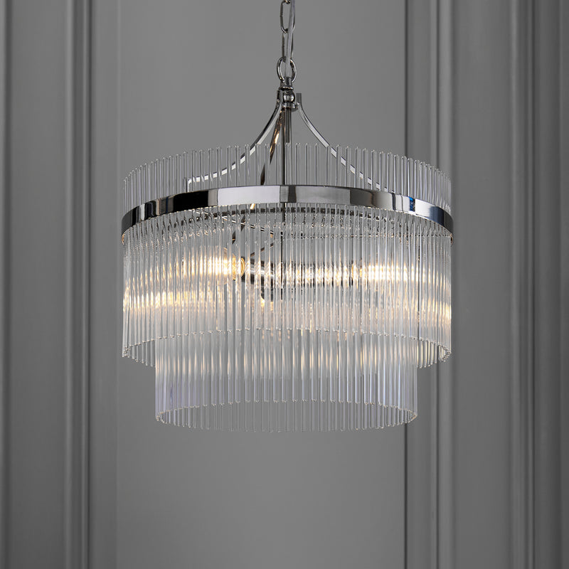Marietta 3 Light Chandelier in bright nickel hanging in a bedroom