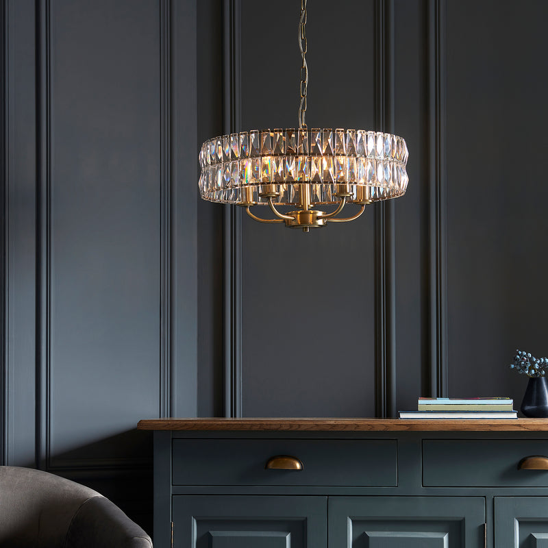 Clifton 5 Light Pendant lit up in a styled living room