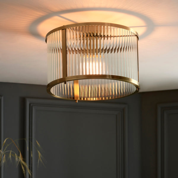 Ridgeton Flush Ceiling Light lit up in a styled hallway