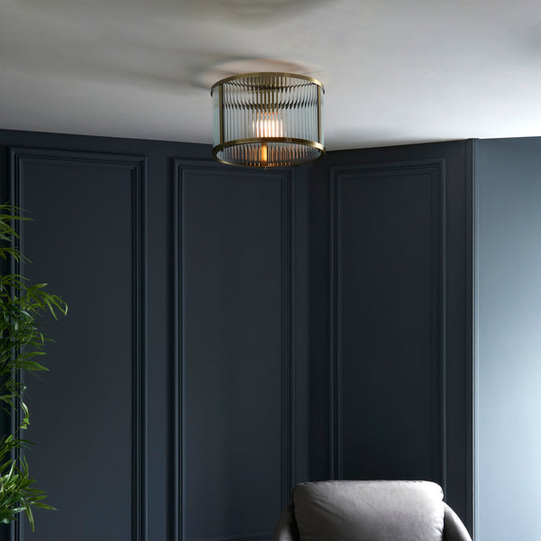 Ridgeton Flush Ceiling Light in antique brass shown in a room setting