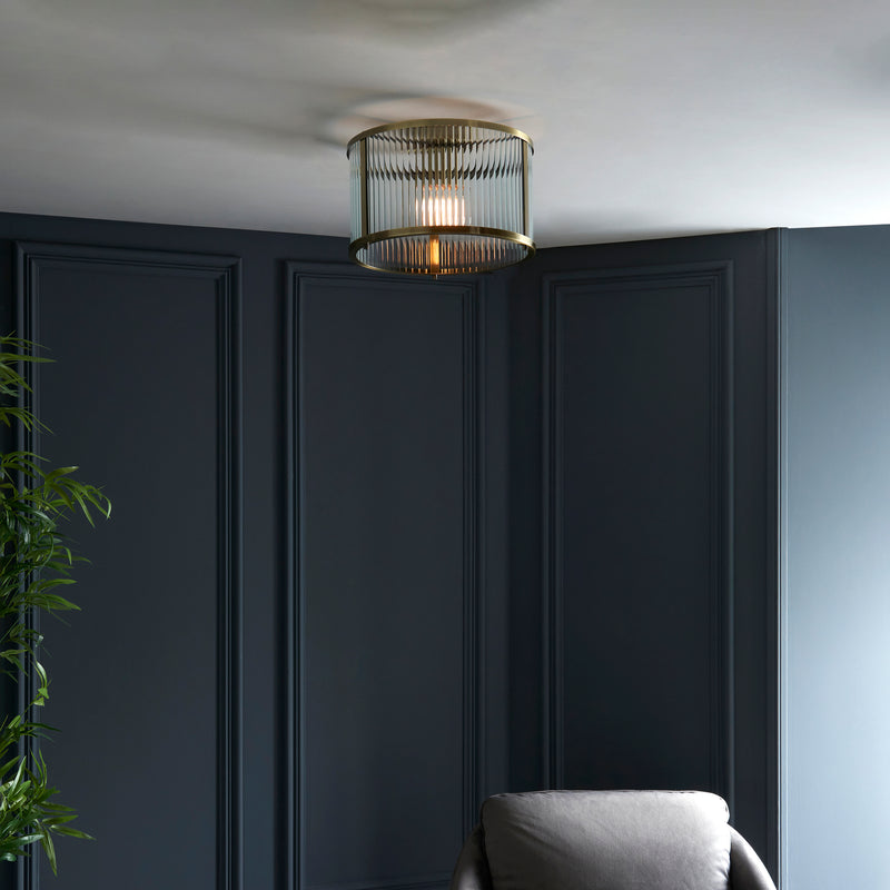 Ridgeton Flush Ceiling Light in antique brass shown in a room setting