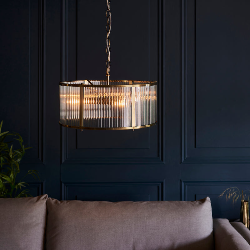 Ridgeton 3 Light Pendant lit up in a styled hallway