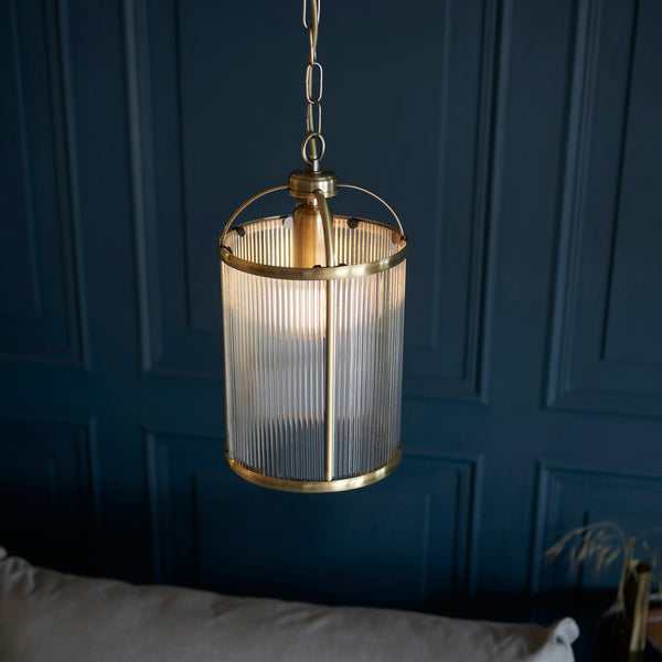 Lambeth Ribbed Lantern Pendant in antique brass shown in a room setting