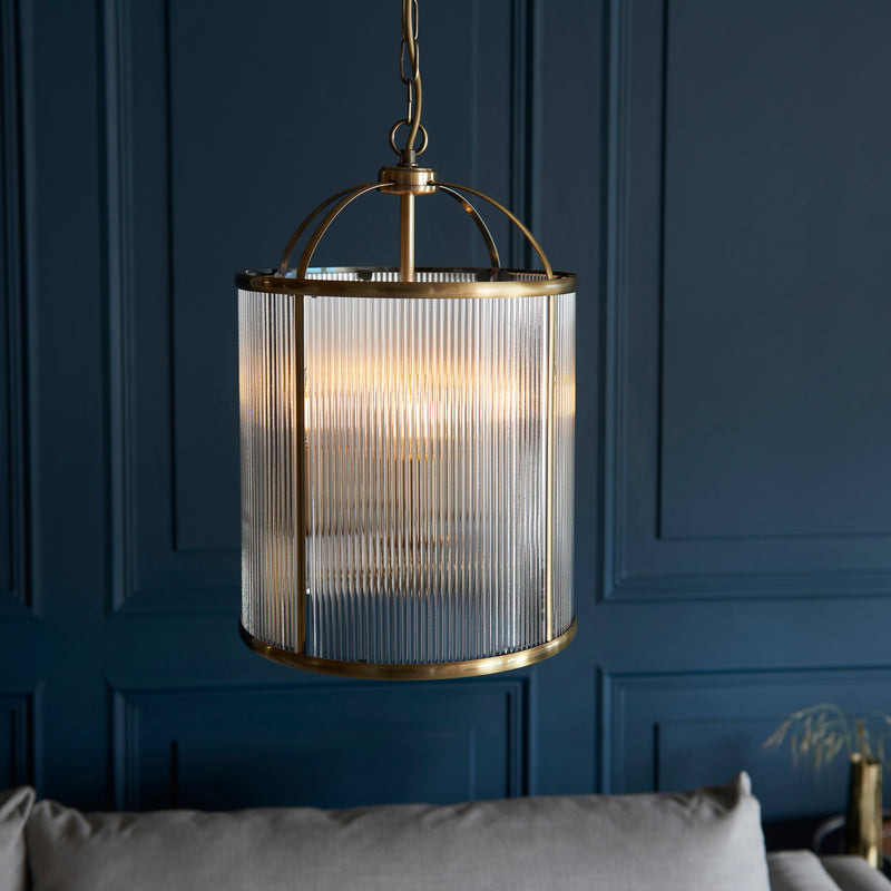 Lambeth Ribbed 4 Light Lantern Pendant in antique brass hanging in a hallway