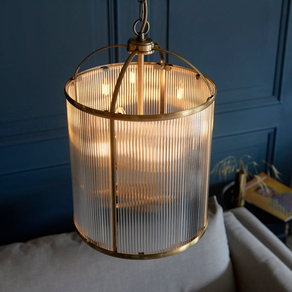 Lambeth Ribbed 4 Light Lantern Pendant in antique brass shown in a room setting