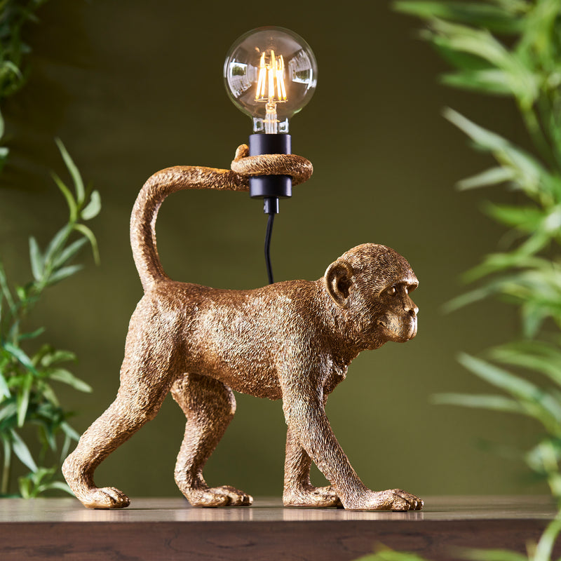 Endon Capuchin Monkey Table Lamp in vintage gold in a styled living room