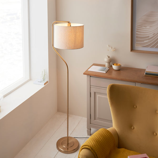 Clement Floor Lamp lit up in a living room setting