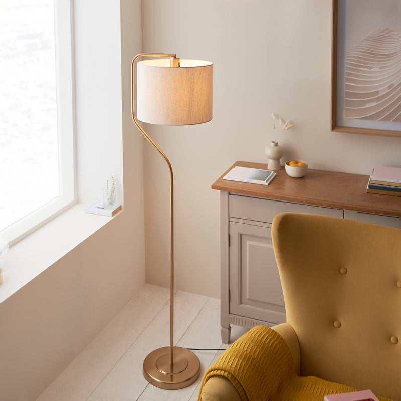 Clement Floor Lamp lit up in a living room setting