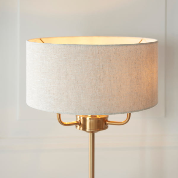 Detail of the vintage brass and linen finish on the Highclere 3 Light Table Lamp