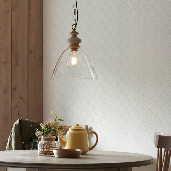 Cotswold Pendant in natural ash hanging in a kitchen