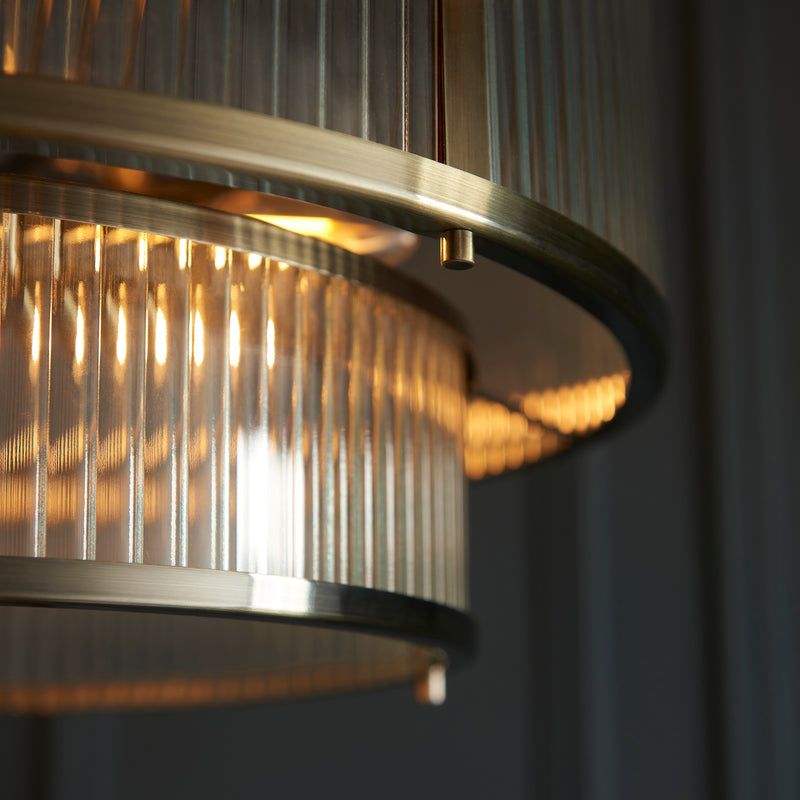 Detail of the antique brass finish on the Ridgeton 5 Light Tiered Pendant