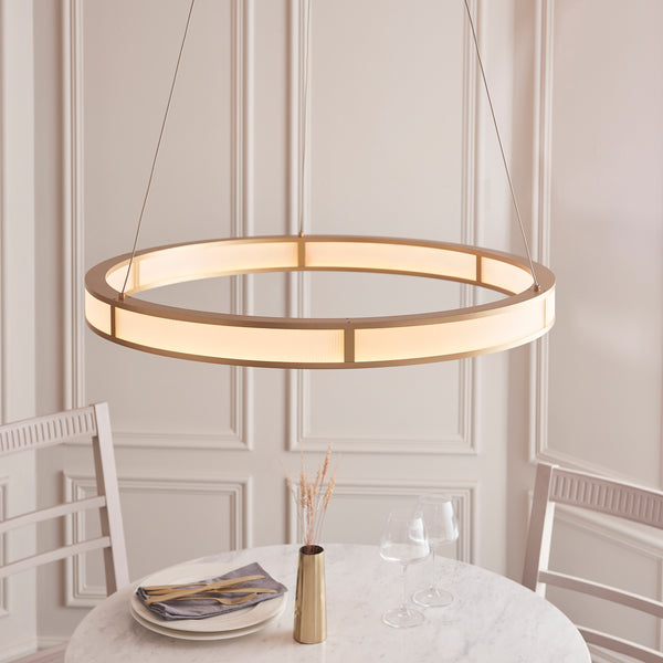 Classic Ribbed LED Hoop Pendant in brushed gold hanging in a living room