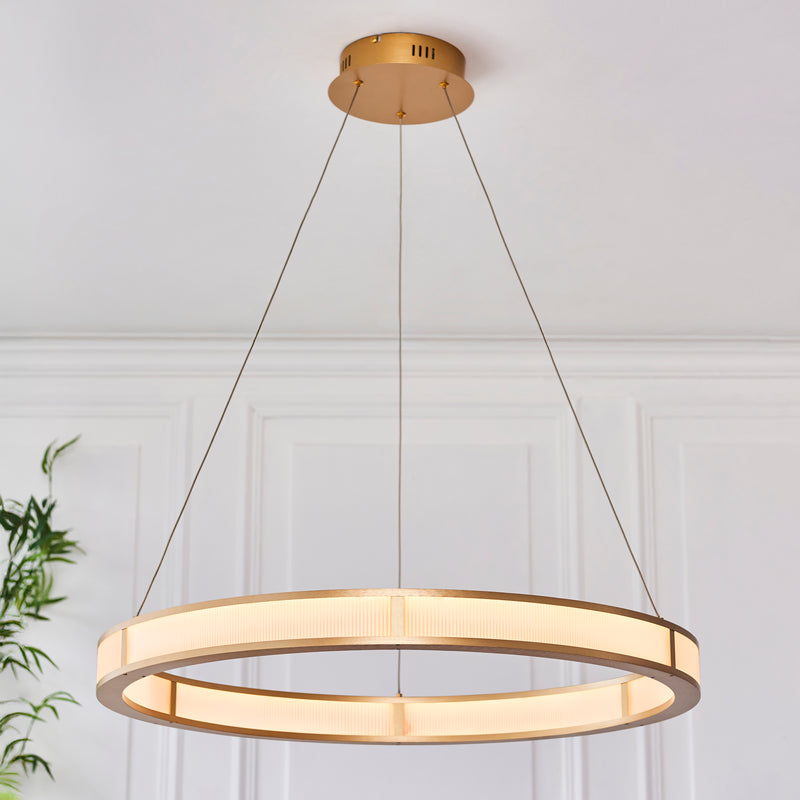 Classic Ribbed LED Hoop Pendant in brushed gold shown in a room setting