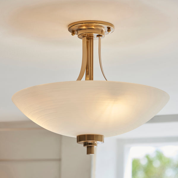 Welles 3 Light Semi Flush Ceiling Light in brushed aged brass on a bedroom ceiling