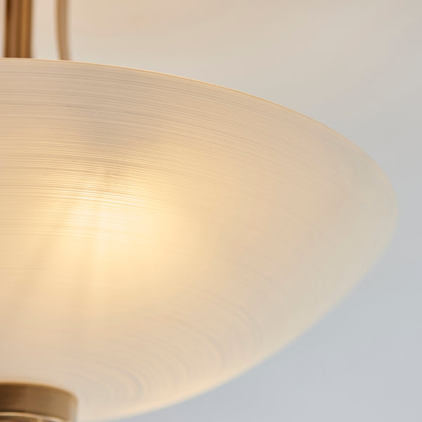 Welles 3 Light Semi Flush Ceiling Light lit up in a styled bedroom