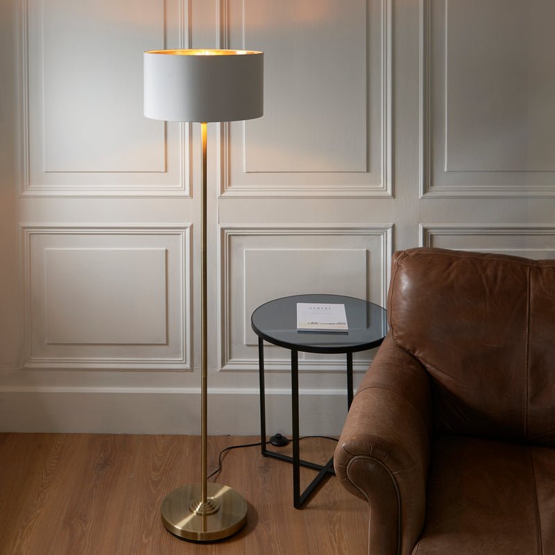 Endon Highclere Floor Lamp in antique brass in a styled living room